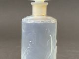 a small glass bottle with a clear top