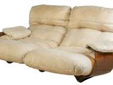 a couch that has two recliners on it