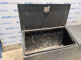 a metal box that is sitting on the ground