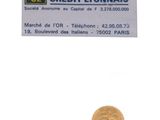 une pièce d'or sur laquelle figure l'image d'un homme