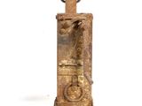 an old rusted metal water pump on a white background