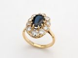 an oval sapphire and diamond cluster ring