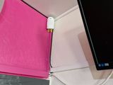 a pink box with a mouse on it next to a monitor