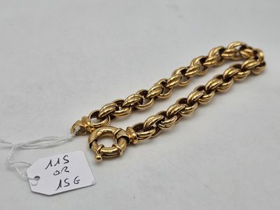 a close up of a gold chain with a price tag on it
