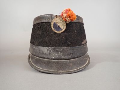 a hat with a fan on top of it on a table