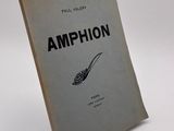 an old book sitting on top of a white table