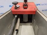 an image of a machine that is working on a piece of metal