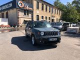 a jeep parked in front of a building in a parking lot
