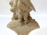marble bust of a woman with a hat on her head