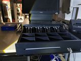 an image of a laptop and other electronic equipment in a drawer