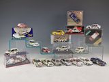 a lot of toy cars on display in a display case