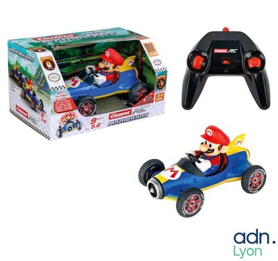 a toy car with a remote control in front of a box