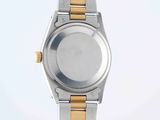 an image of a close up of a wrist watch on a white surface