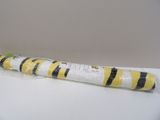 a yellow and black striped tube wrapped in plastic