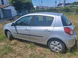 a silver car that is parked in the grass