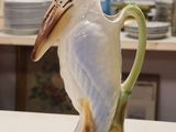a bird that is sitting on top of a vase