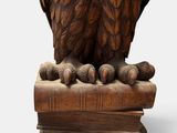 an image of a statue of an owl sitting on top of a wooden block