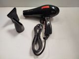 a hair dryer and a charger sitting on a table