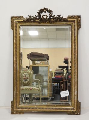 a mirror that is sitting on the floor in a room