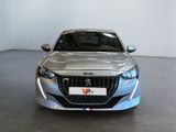 a silver car parked in a room with a white wall