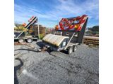 une image représentant un camion-benne surmonté d'un drapeau