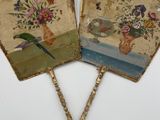 pair of hand painted fan with flowers and birds on them
