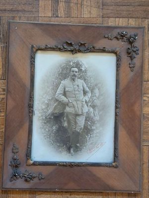 a picture of a man that is sitting in a picture frame
