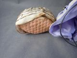 a bag with a cookie inside of it sitting on a table
