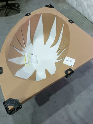 a cardboard table with a paper cut out of it
