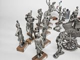 a lot of figurines that are sitting on a table