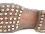 an image of a close up of a pair of shoes with studded soles