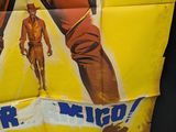 movie poster of a man in a cowboy outfit holding a gun