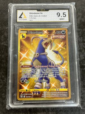 a pokemon card in a plastic case on a table