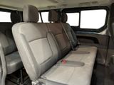 two seats in the back of a van with a bench