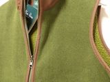 a close up of a green vest on a hanger