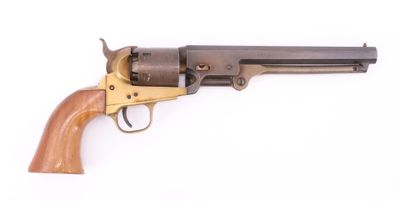 a close up of a revolver with a wooden handle on a white background
