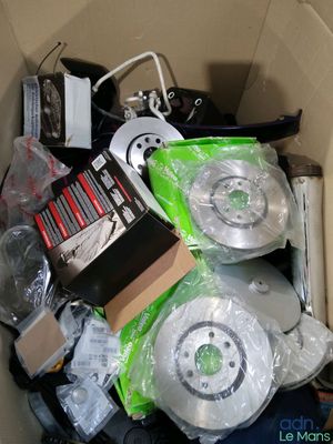 a cardboard box filled with electronics and other items