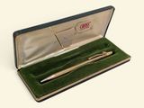 a pen in a case that is open on a table