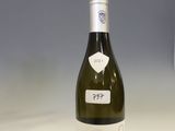 a bottle of wine that is sitting on a table