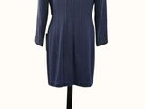an image of a blue coat on a mannequin stand