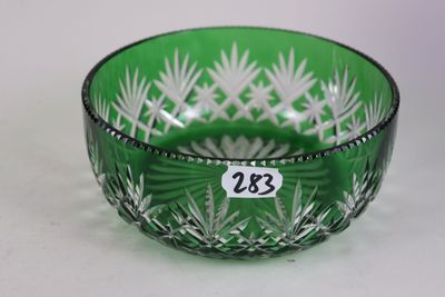 an image of a green glass bowl sitting on top of a table