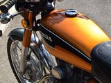 a close up of a motorcycle parked on the street