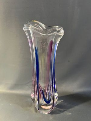 a glass vase that is sitting on a table
