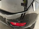 a car that has a bunch of bananas on the back of it