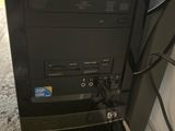 a black computer sitting on top of a desk