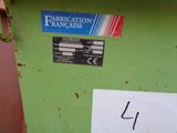 an image of a green trash can with a sticker on it