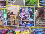 a lot of pokemon cards that are on the table
