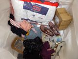 a pile of clothes and other items in a bag