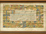 an old manuscript with a gold border and a blue and green border
