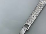 a watch that is laying in the water on the table